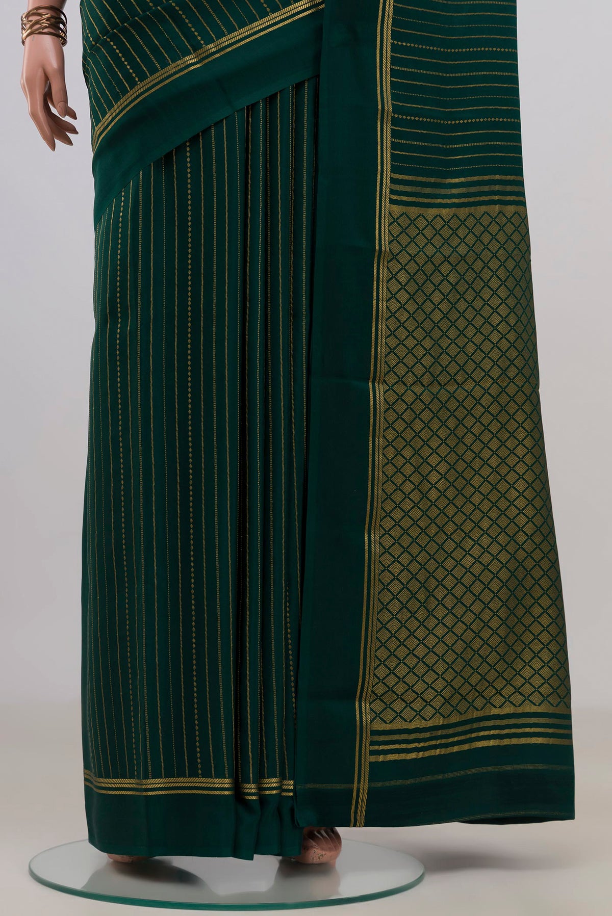 Pleats and pallu of Bottle Green Mysore Crepe Saree with Stripes on the body and Thin Zari Line. 