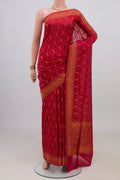Pure Silk Red Banarasi Saree with Thread Butta on the body and Zari Border.  displayed on a mannequin