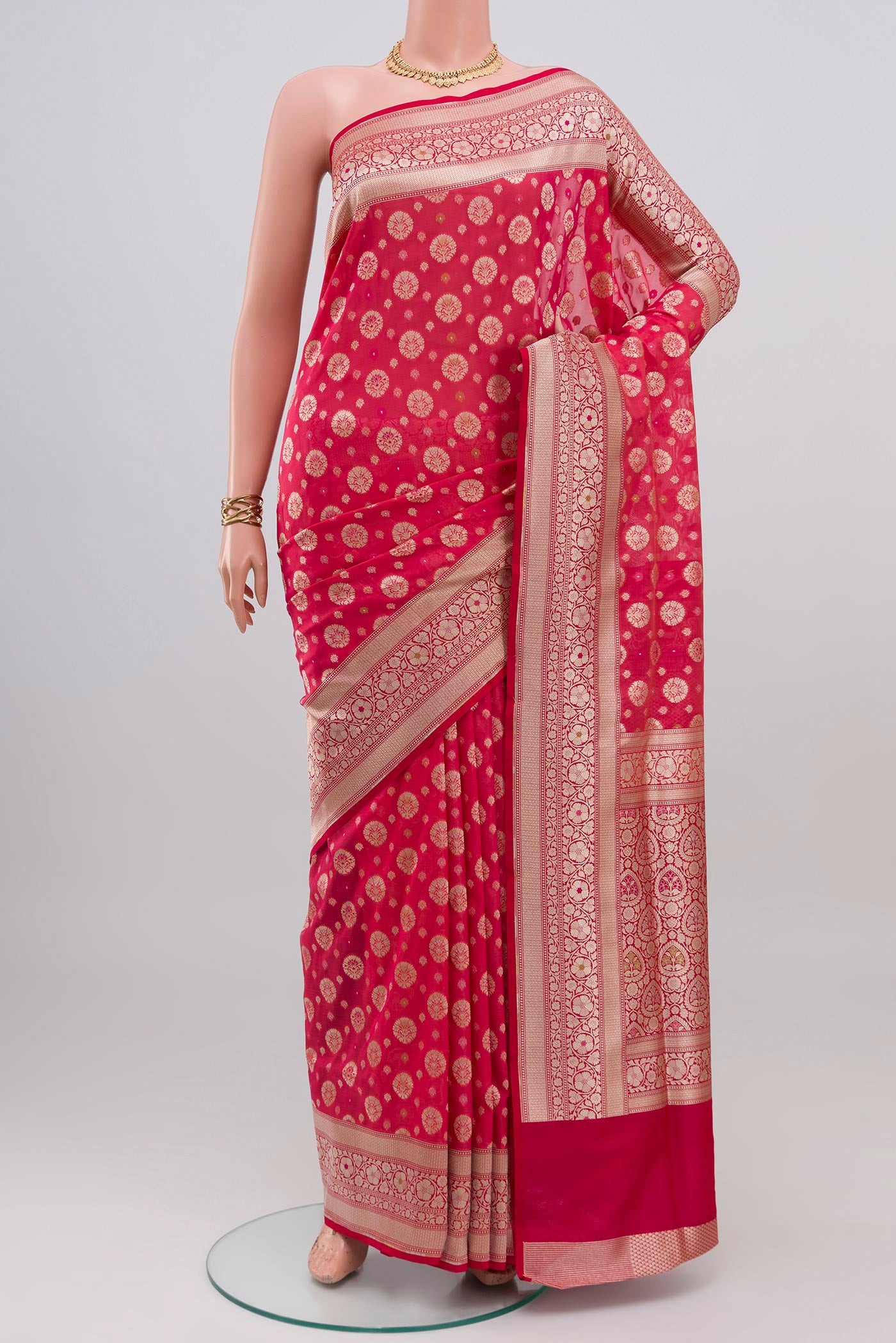 Pink Banarasi Silk Saree with Zari And Thread Butta on the body and Zari Border.  displayed on a mannequin