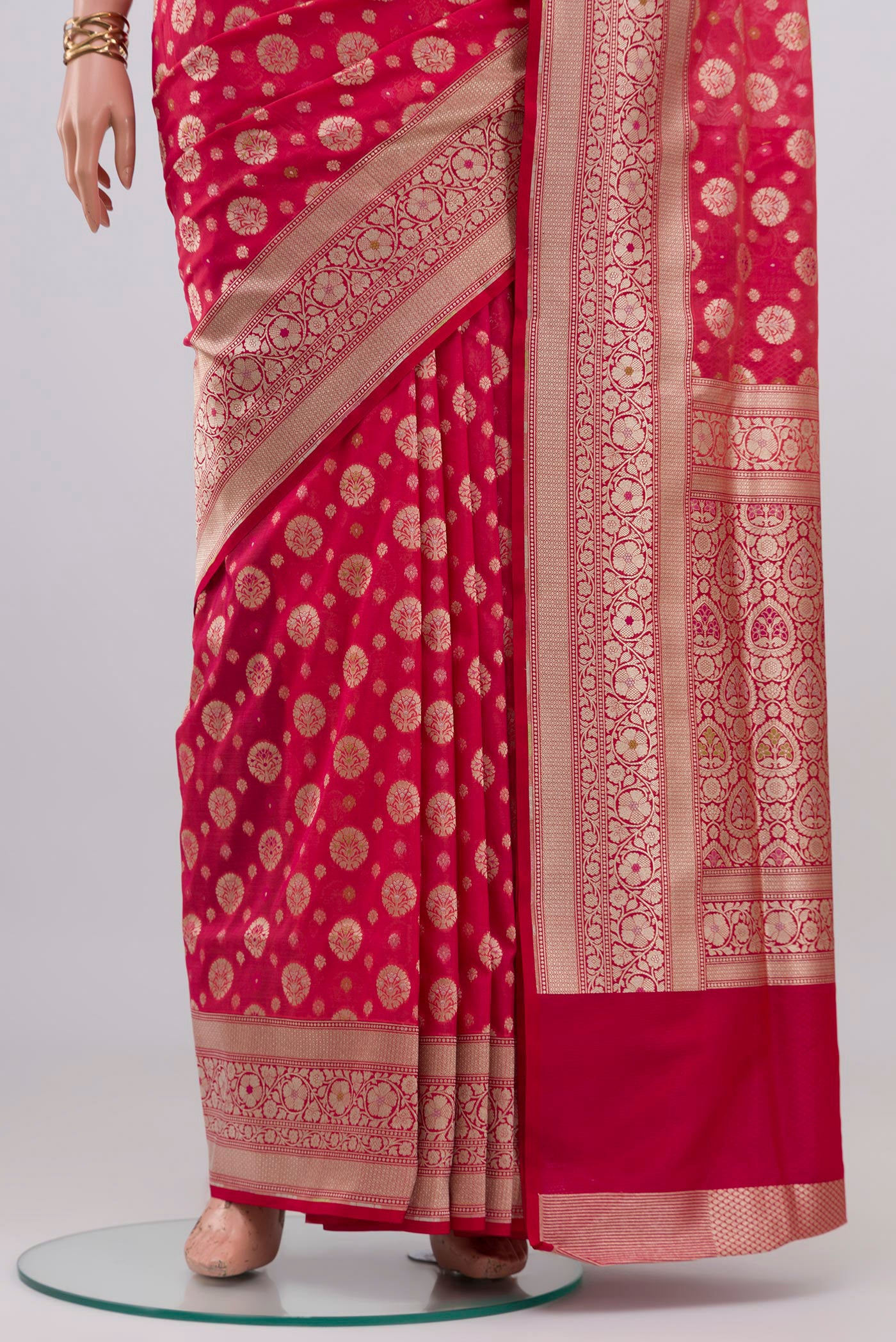 Pleats and pallu of Pink Banarasi Silk Saree with Zari And Thread Butta on the body and Zari Border. 