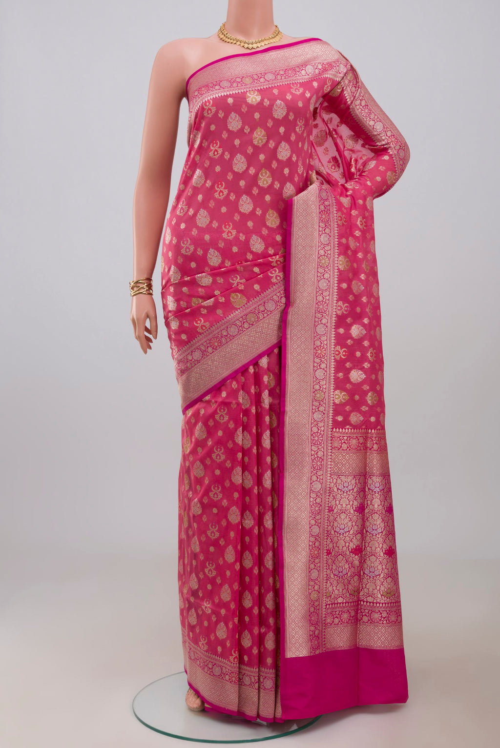 Pink Banarasi Saree with Fancy on the body and Fancy Border.  displayed on a mannequin