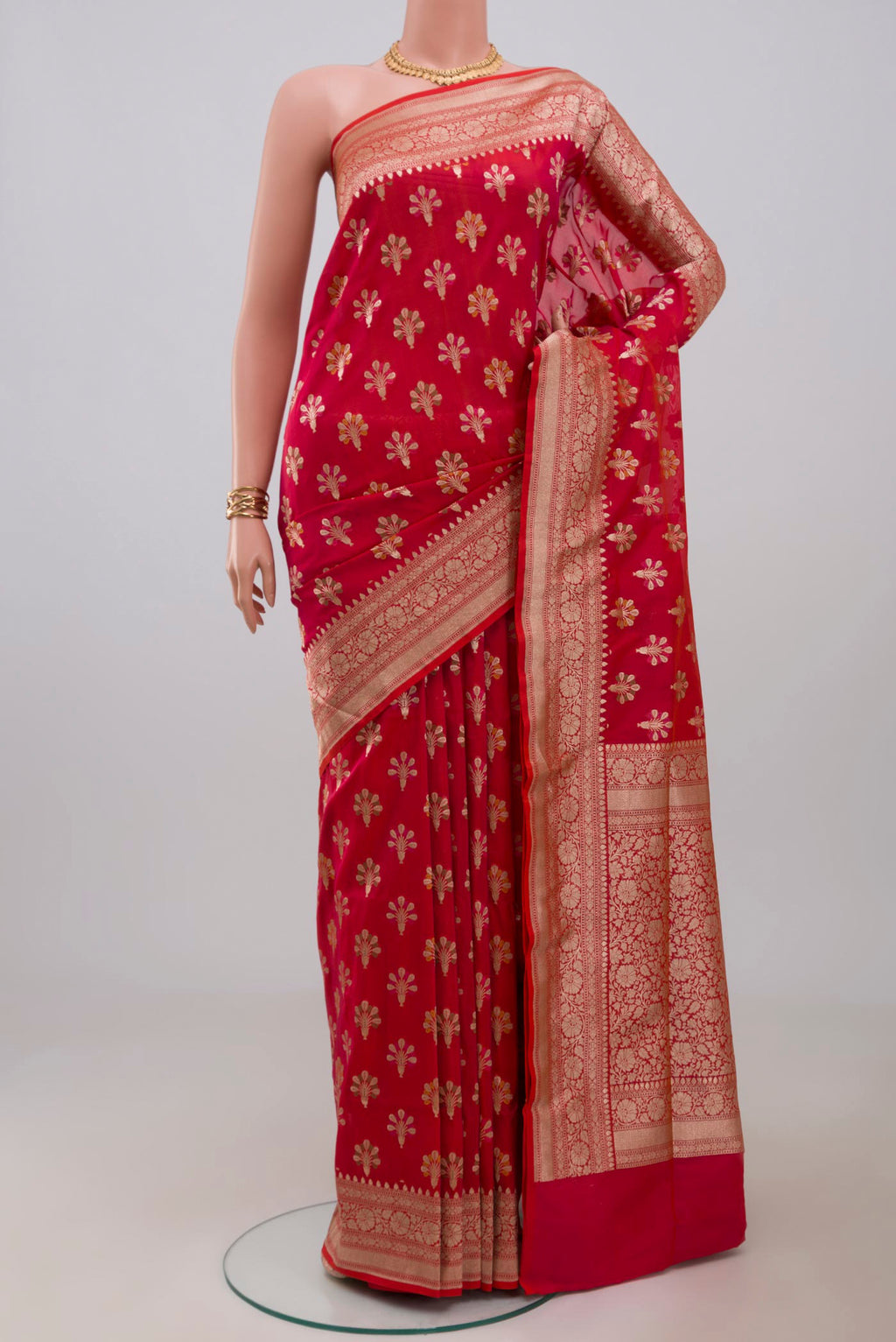 Pink Banarasi Saree with Zari Butta on the body and Fancy Border.  displayed on a mannequin