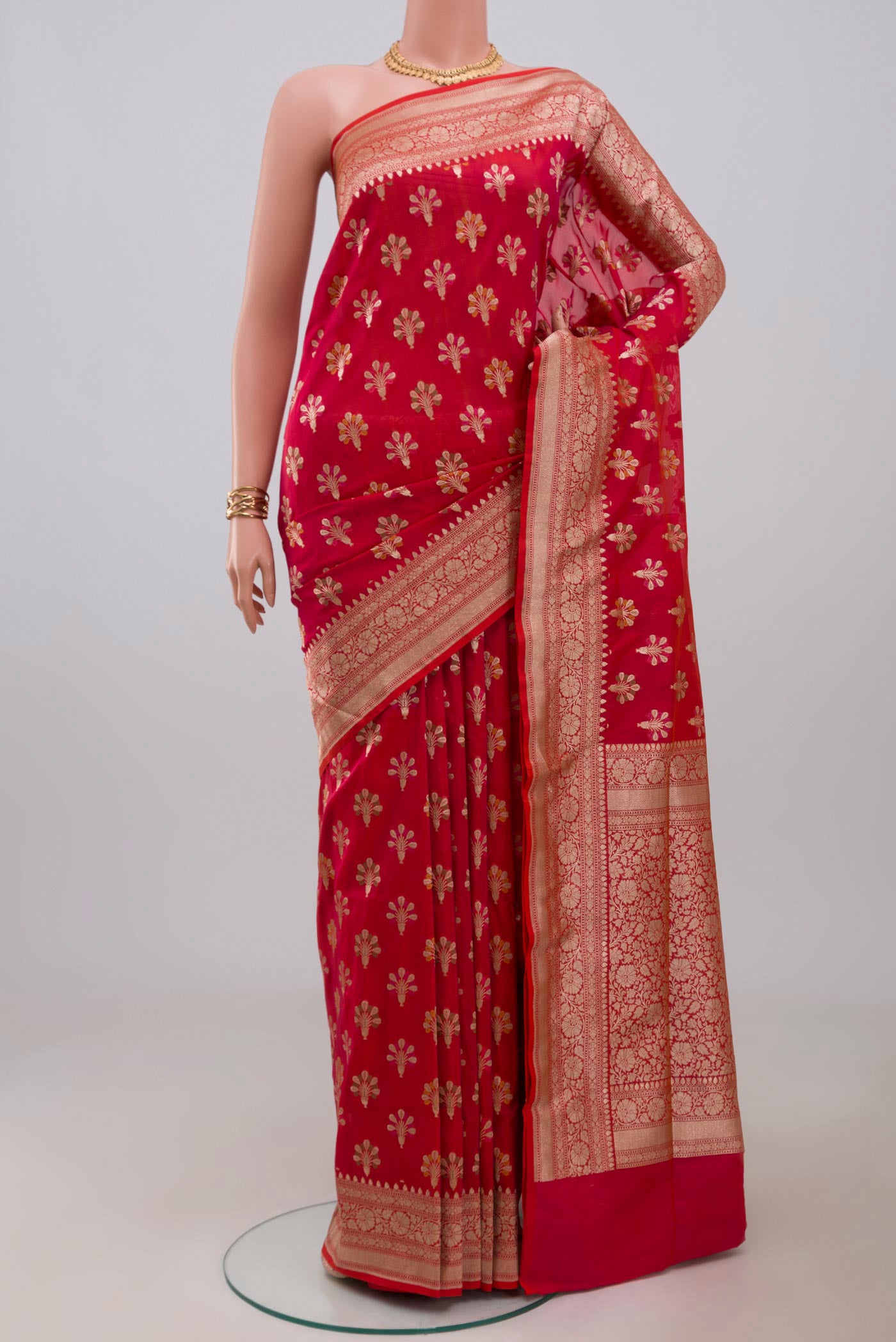 Pink Banarasi Saree with Zari Butta on the body and Fancy Border.  displayed on a mannequin