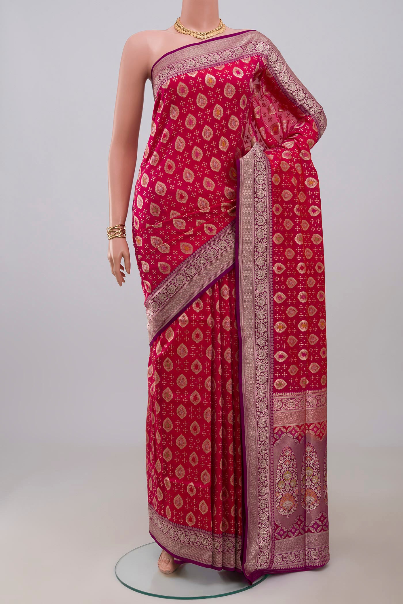Pink Banarasi Saree with Fancy on the body and Fancy Border.  displayed on a mannequin