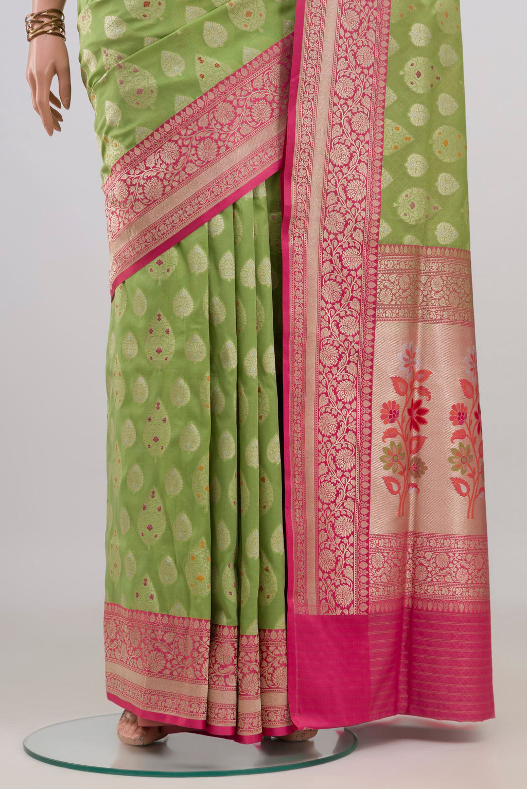 Pleats and pallu of Pure Silk Green Banarasi Saree with Zari Butta on the body and Fancy Border. 