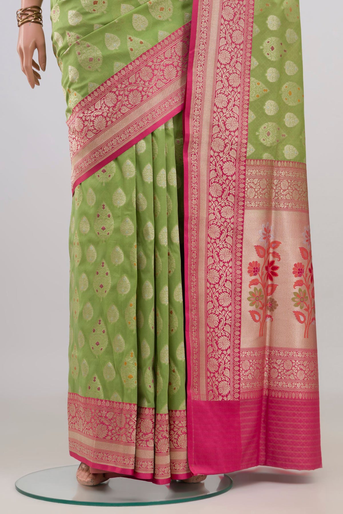 Pleats and pallu of Pure Silk Green Banarasi Saree with Zari Butta on the body and Fancy Border. 