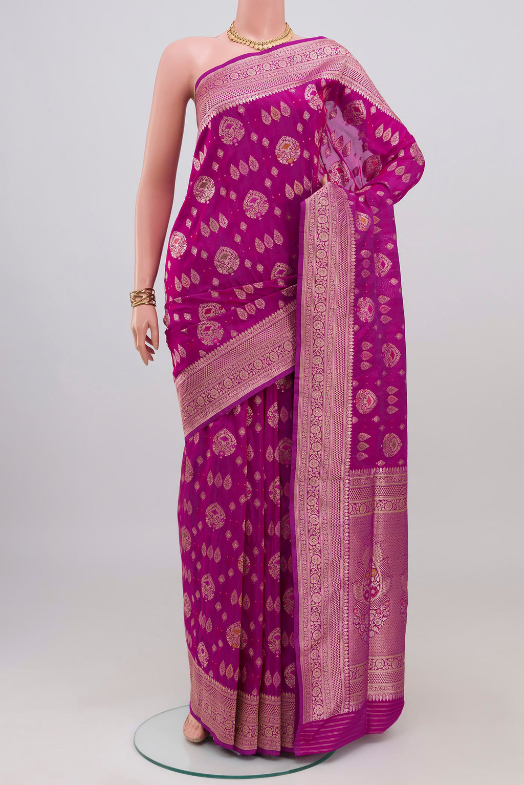 Magenta Banarasi Silk Saree with Zari Brocade on the body and Fancy Border.  displayed on a mannequin