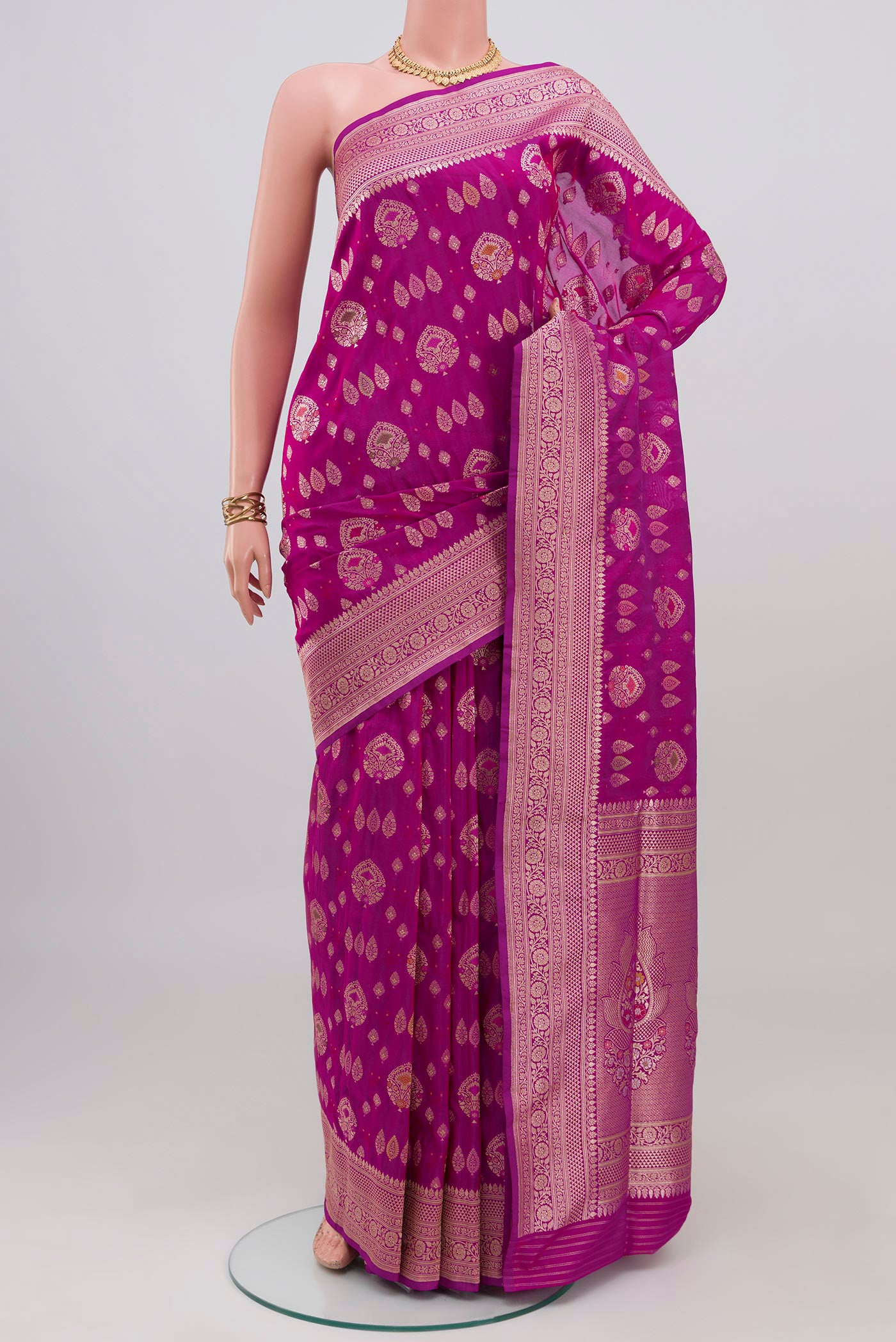 Magenta Banarasi Silk Saree with Zari Brocade on the body and Fancy Border.  displayed on a mannequin