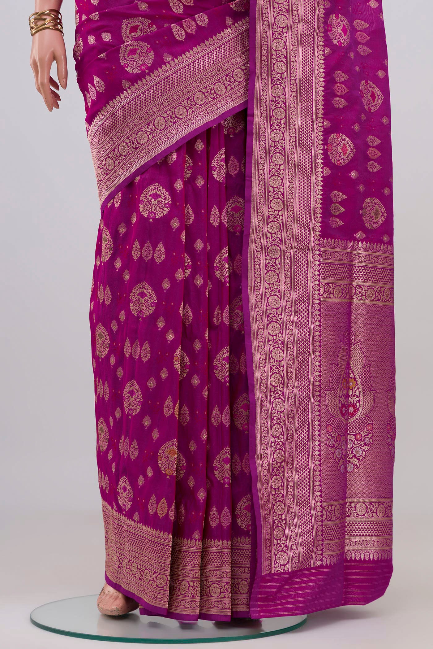 Pleats and pallu of Magenta Banarasi Silk Saree with Zari Brocade on the body and Fancy Border. 