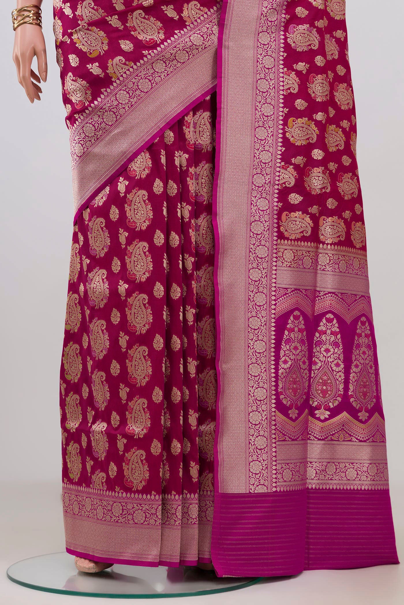 Pleats and pallu of Magenta Banarasi Silk Saree with Zari Brocade on the body and Zari Border. 
