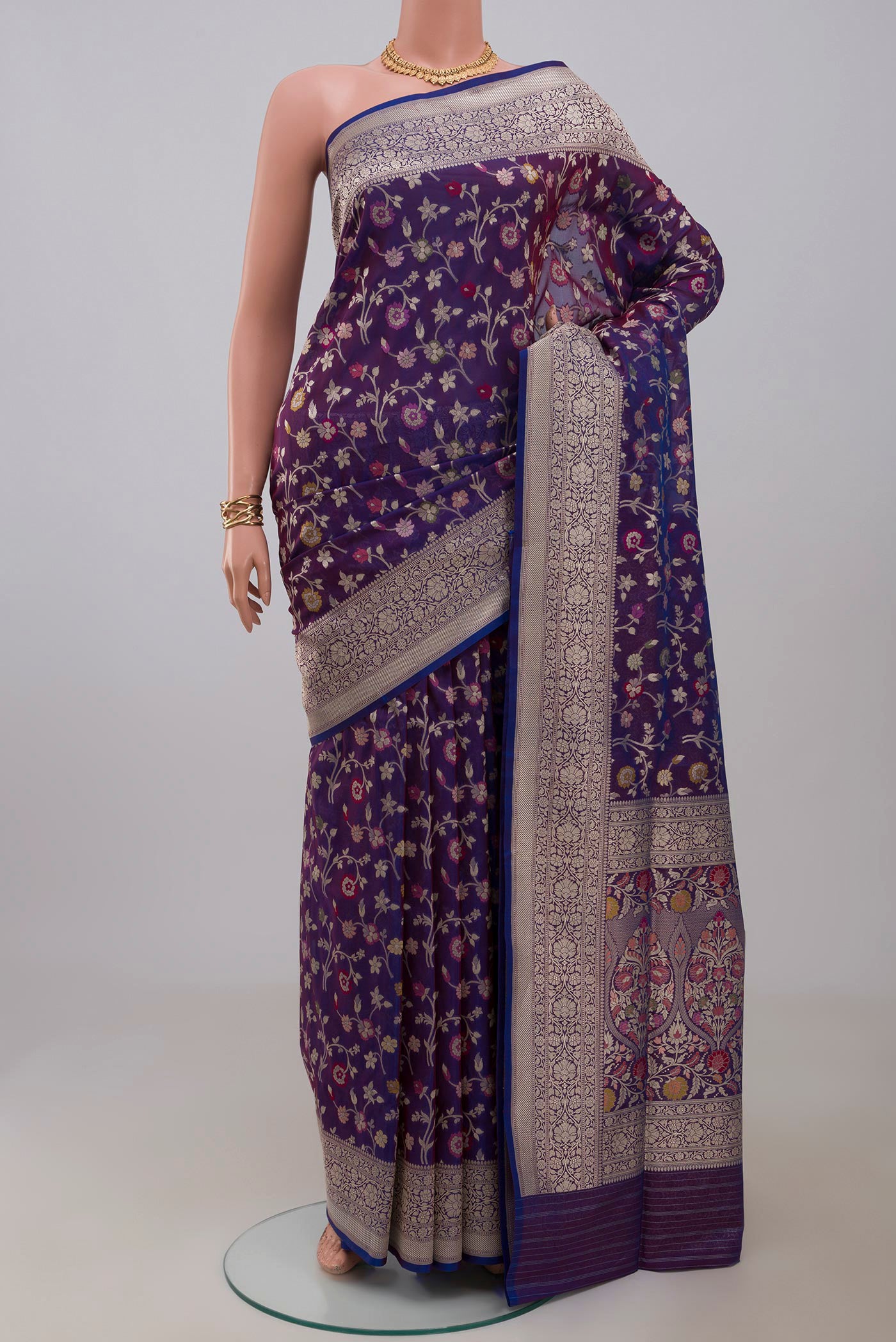 Blue Banarasi Saree with Fancy on the body and Fancy Border.  displayed on a mannequin