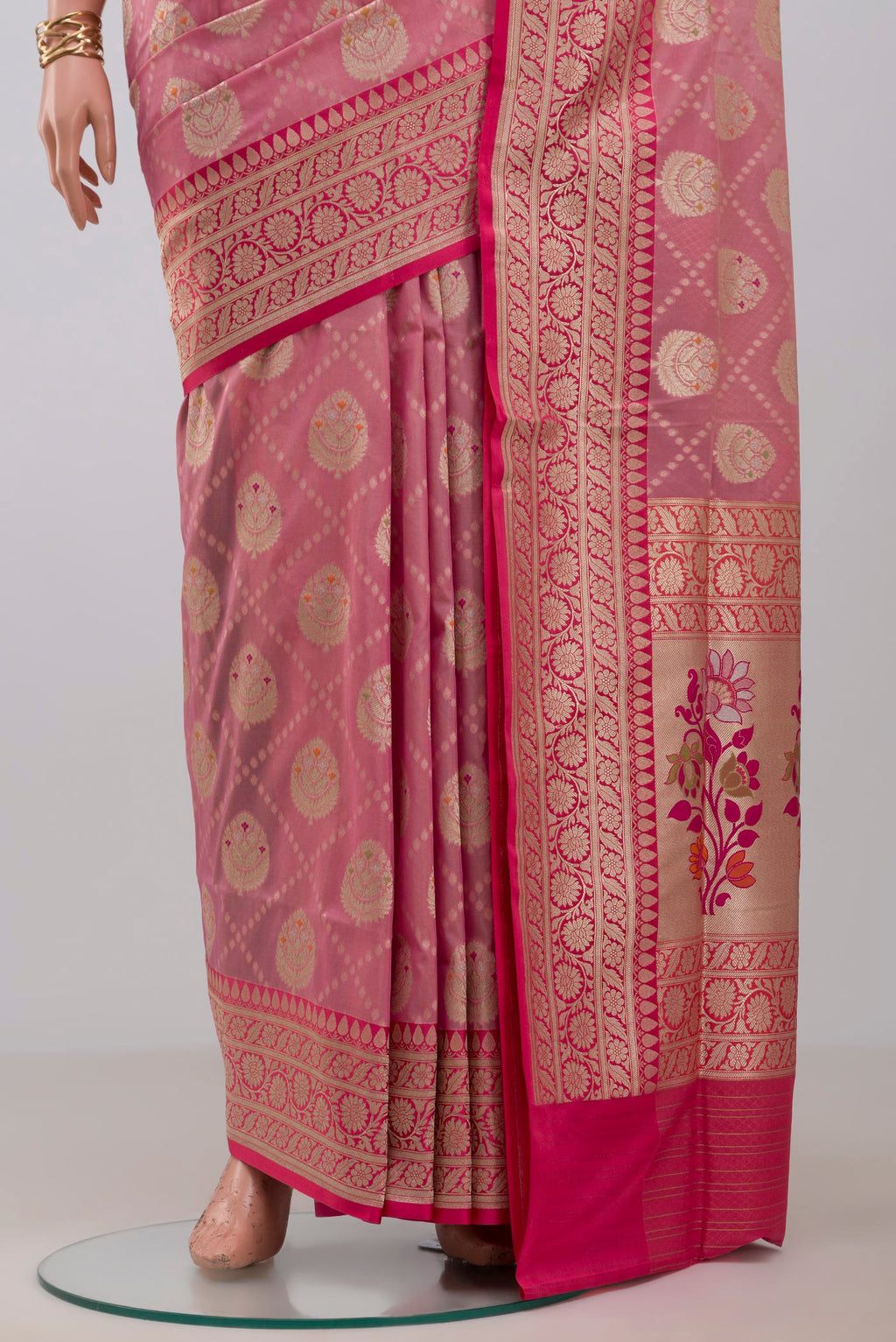 Pleats and pallu of Peach Banarasi Saree with Fancy on the body and Fancy Border. 