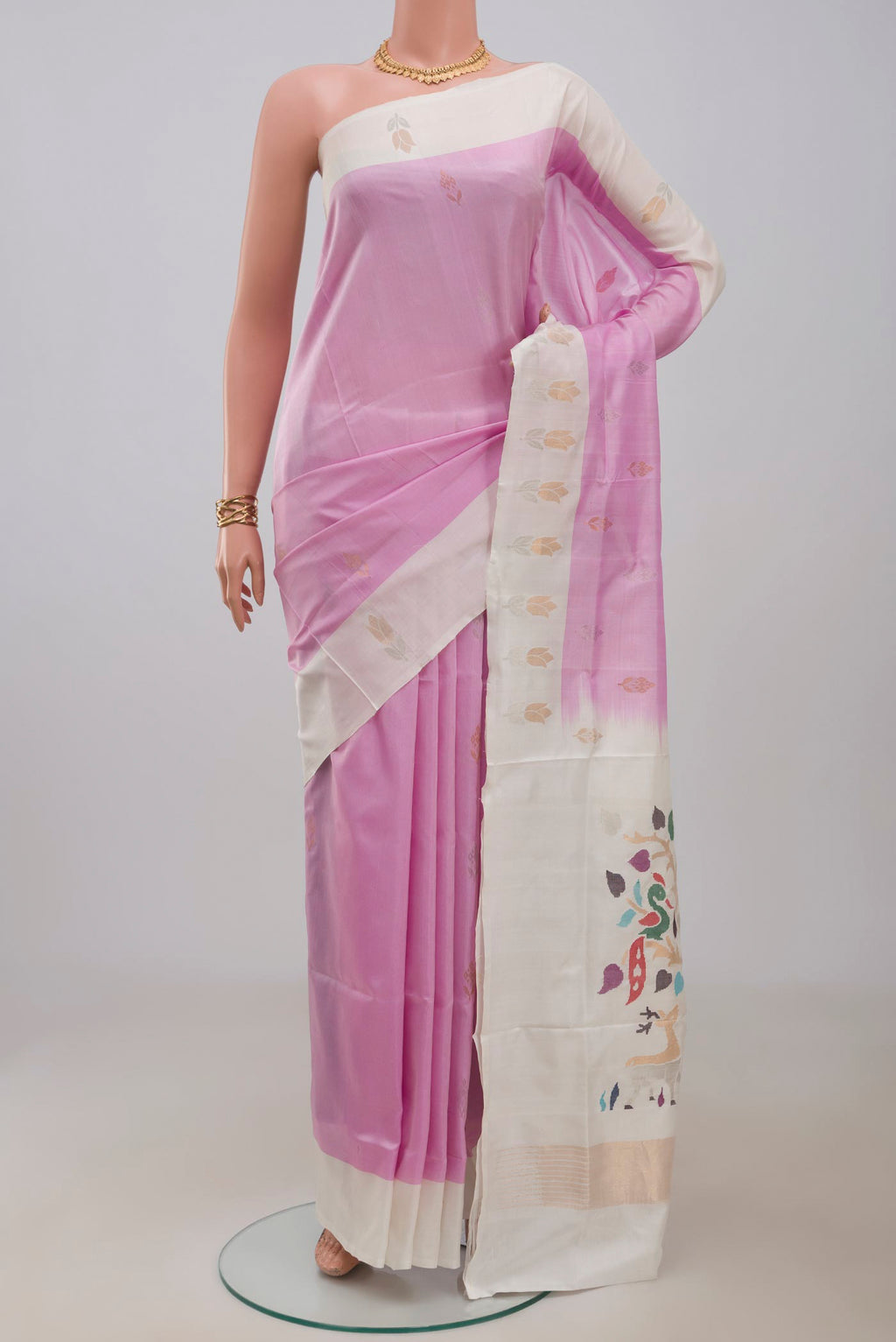 Rose pink Uppada Silk Saree with Zari Butta on the body and Fancy Border.  displayed on a mannequin