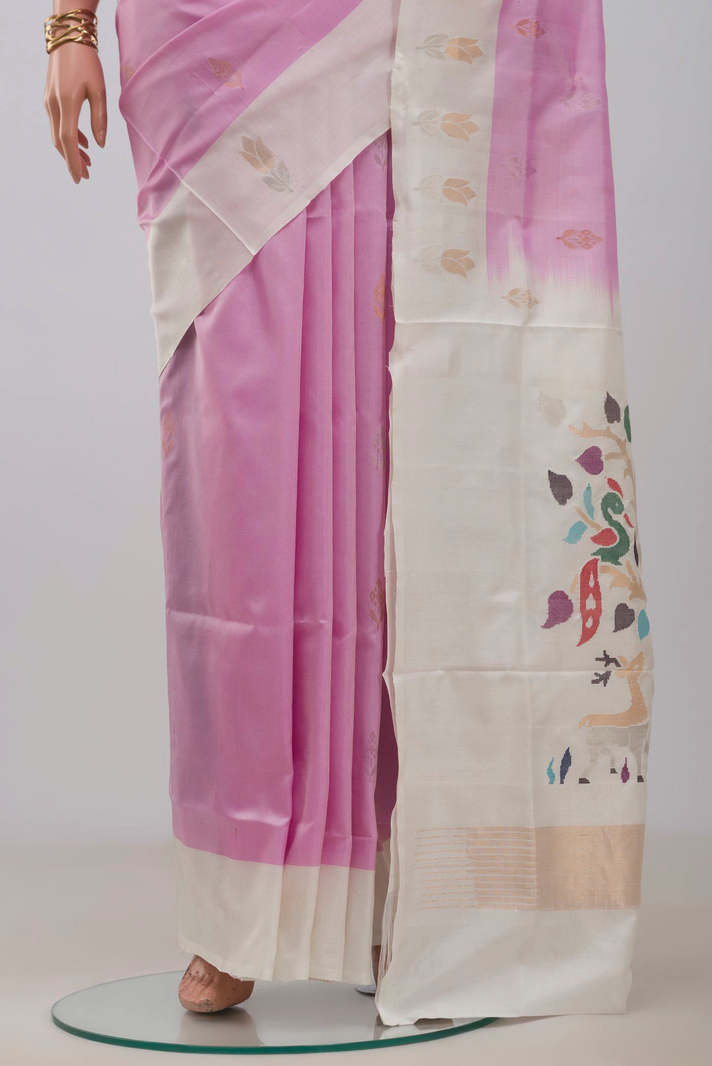 Pleats and pallu of Rose pink Uppada Silk Saree with Zari Butta on the body and Fancy Border. 