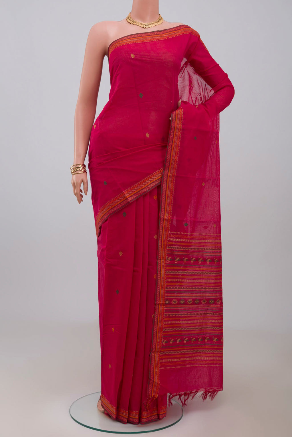 Pink Kanchi Cotton Saree with Thread Butta on the body and Thread Border.  displayed on a mannequin