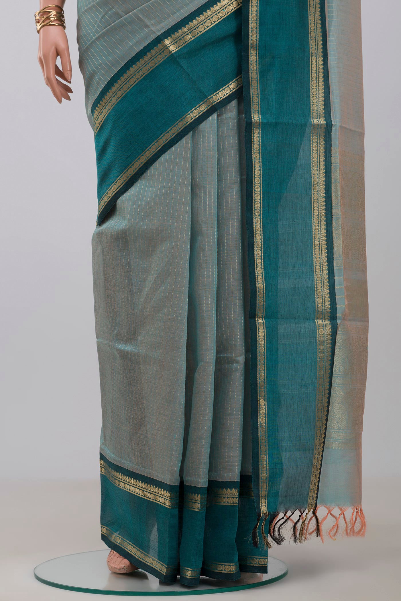 Pleats and pallu of Light Blue Silk Cotton Saree with Stripes on the body and Zari Border. 