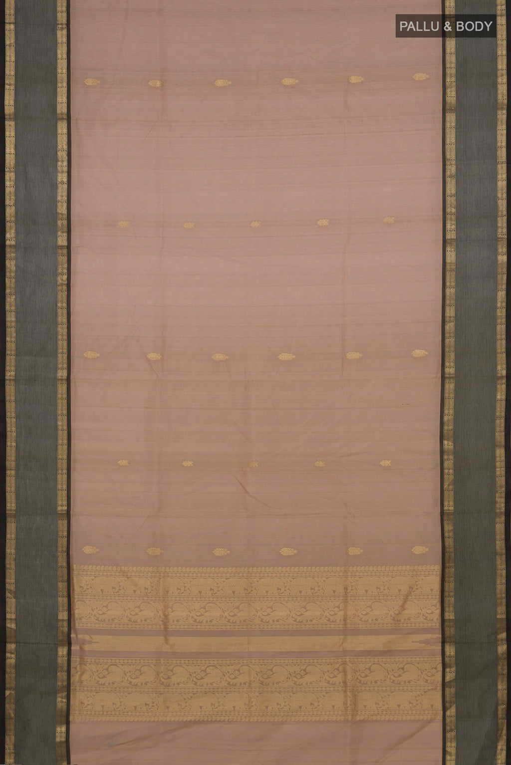 Flat view of Beige Silk Cotton Saree with Zari Butta on the body and Zari Border. 