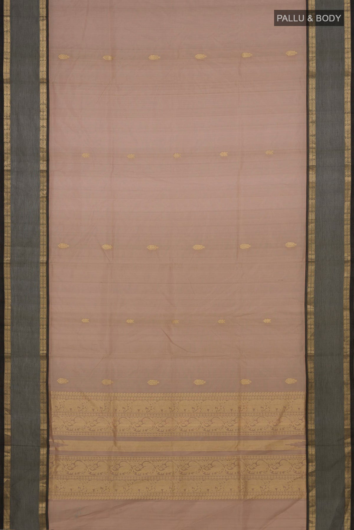 Flat view of Beige Silk Cotton Saree with Zari Butta on the body and Zari Border. 