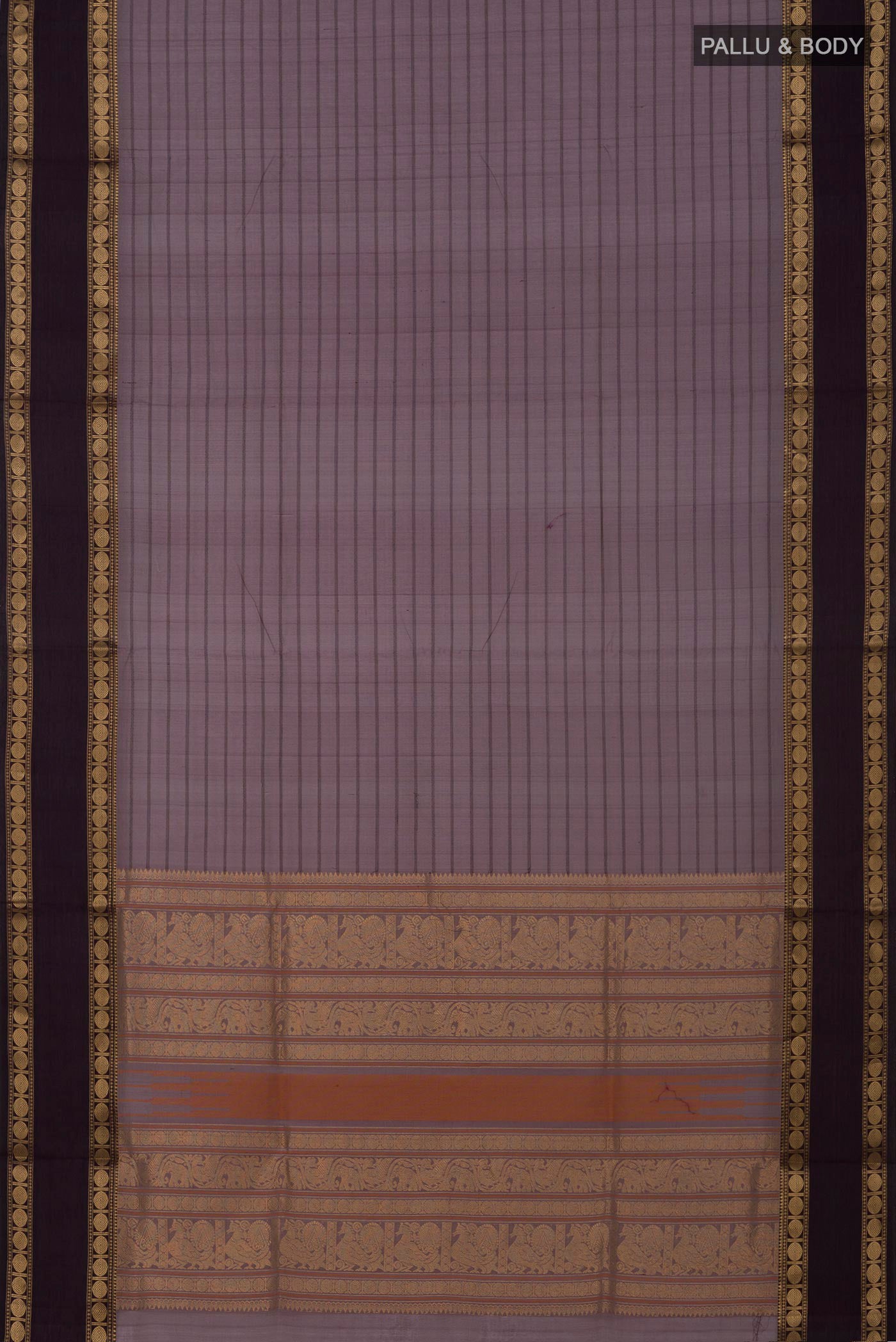 Flat view of Grey Silk Cotton Saree with Veldhari on the body and Zari Border. 