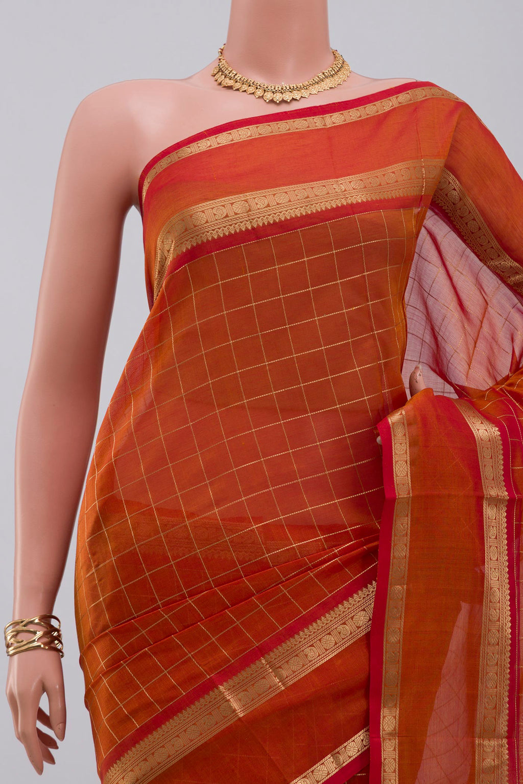 Border image of Orange Silk Cotton Saree with Checked design on the body and Zari Border. 