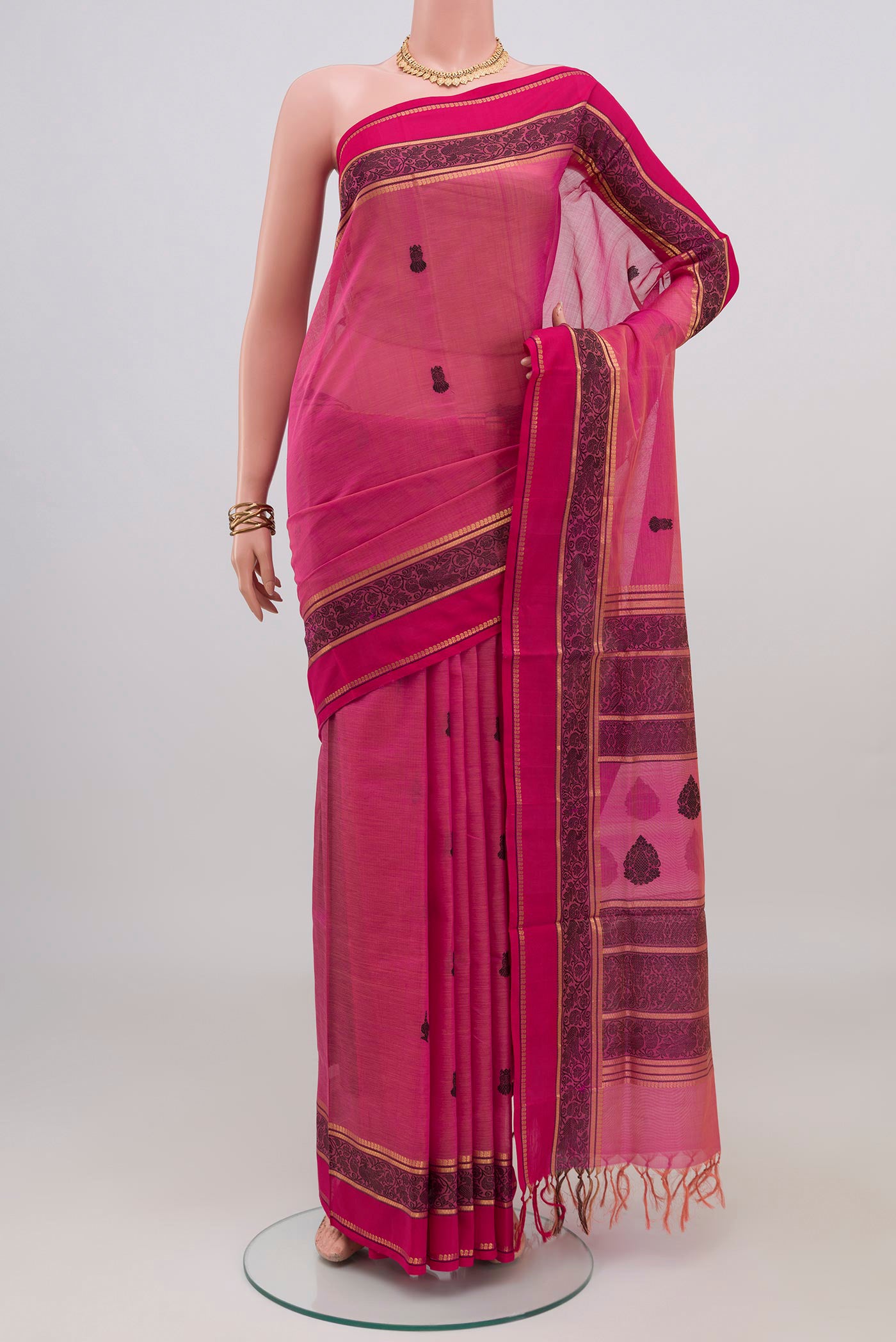 Pink Silk Cotton Saree with Thread Butta on the body and Thread Border.  displayed on a mannequin