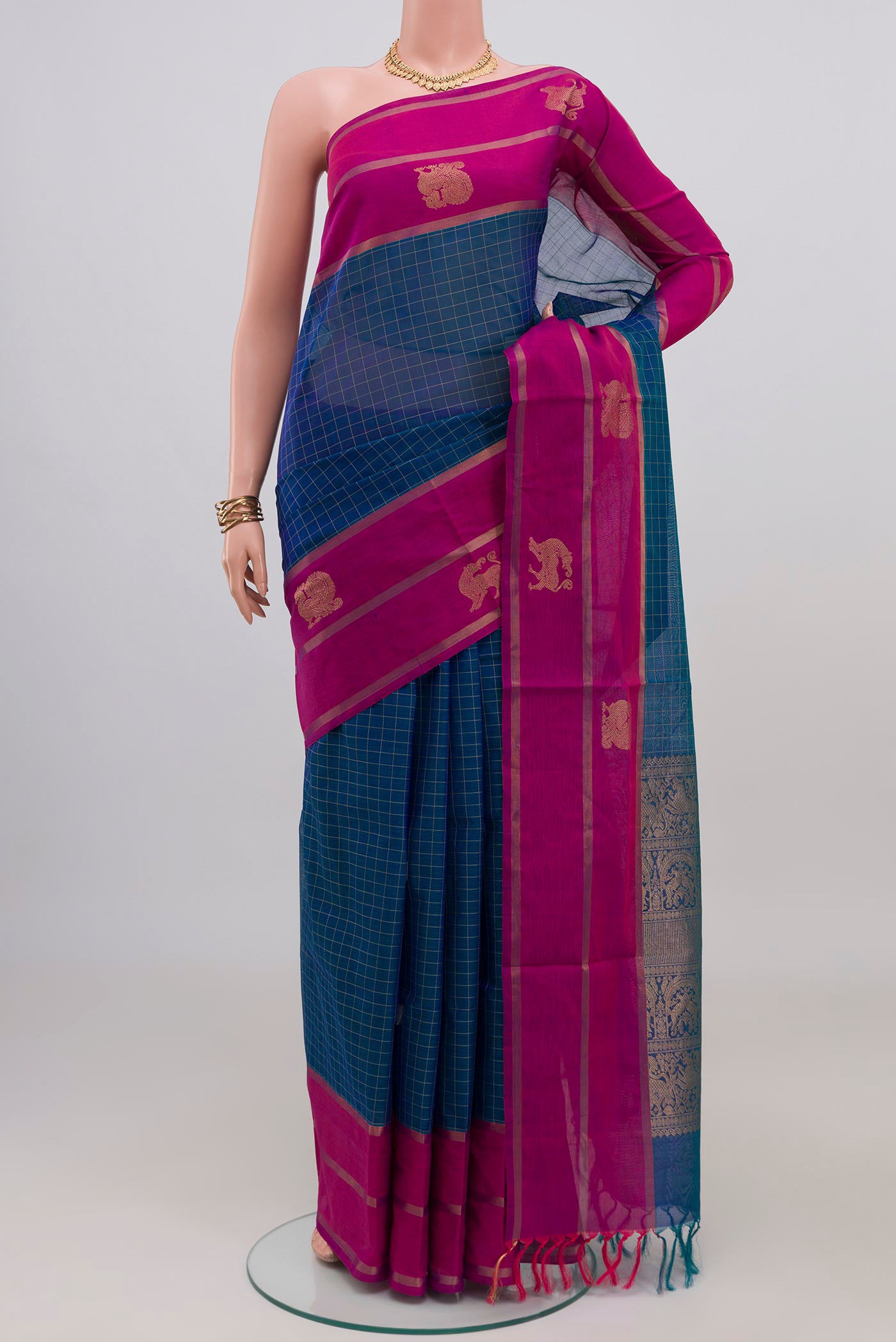 Blue Silk Cotton Saree with Checked design on the body and Plain Border.  displayed on a mannequin
