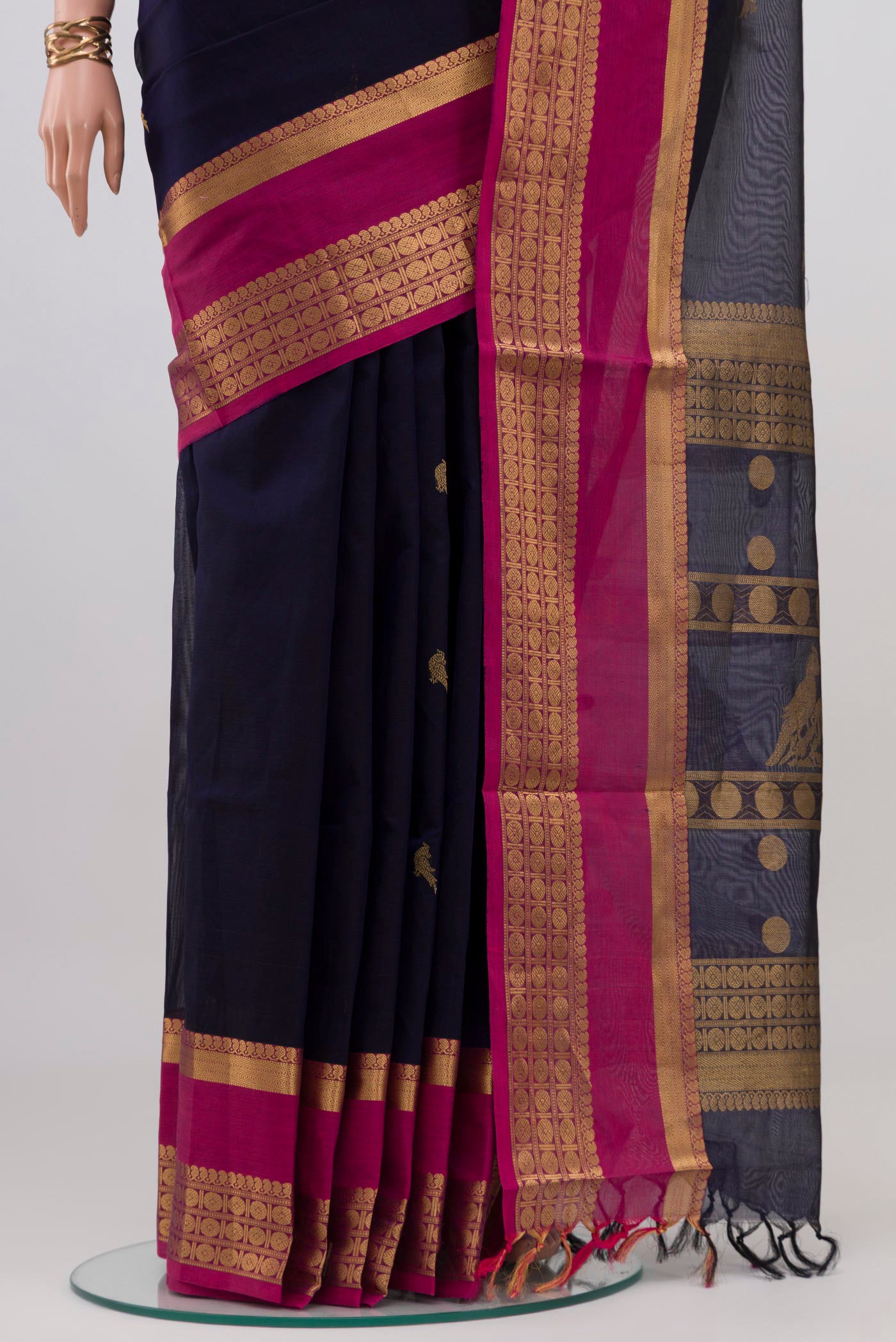 Pleats and pallu of Navy Blue Silk Cotton Saree with Zari Butta on the body and Zari Border. 