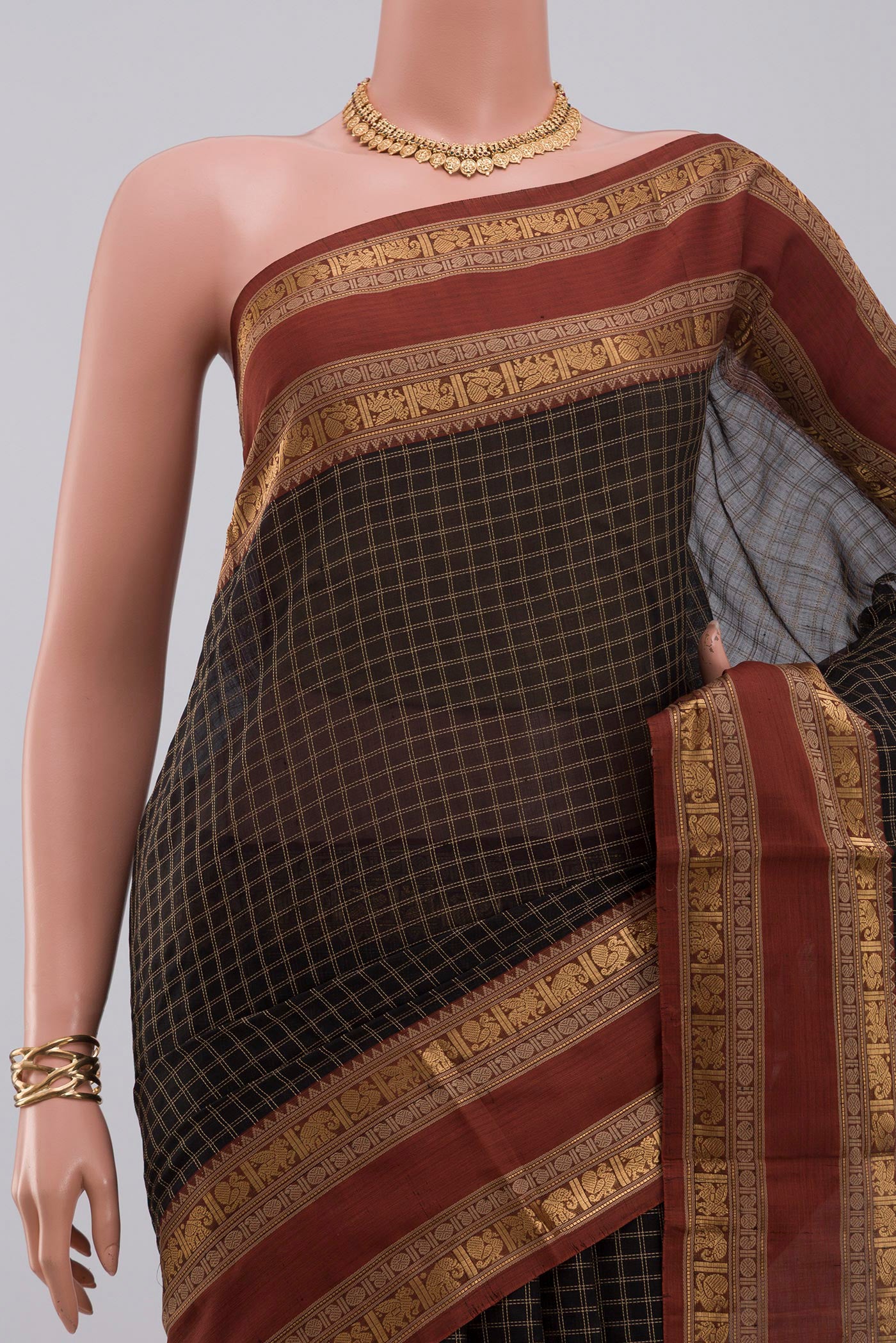 Border image of Black Silk Cotton Saree with Checked design on the body and Zari Border. 