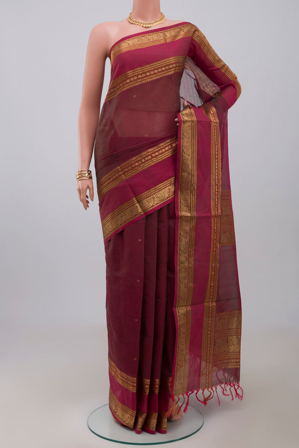 Pink Dual Tone Silk Cotton Saree with Zari Butta on the body and Zari Border.  displayed on a mannequin