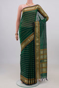 Green Dual Tone Silk Cotton Saree with Veldhari on the body and Zari Border.  displayed on a mannequin