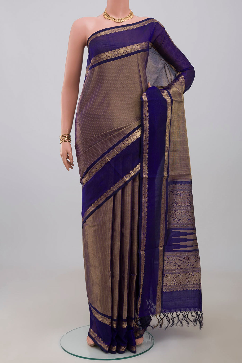 Blue Silk Cotton Saree with Zari Brocade on the body and Zari Border.  displayed on a mannequin