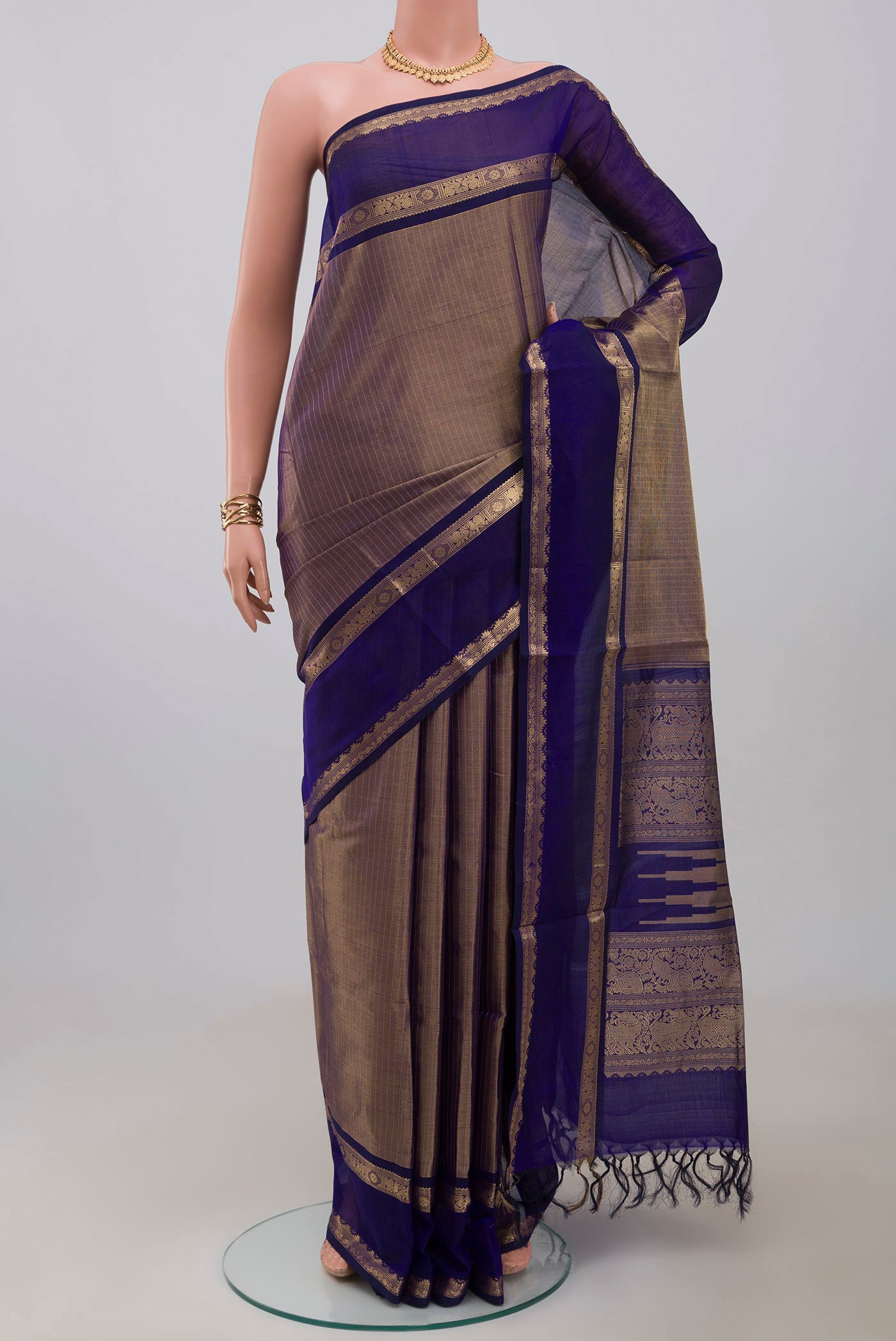 Blue Silk Cotton Saree with Zari Brocade on the body and Zari Border.  displayed on a mannequin