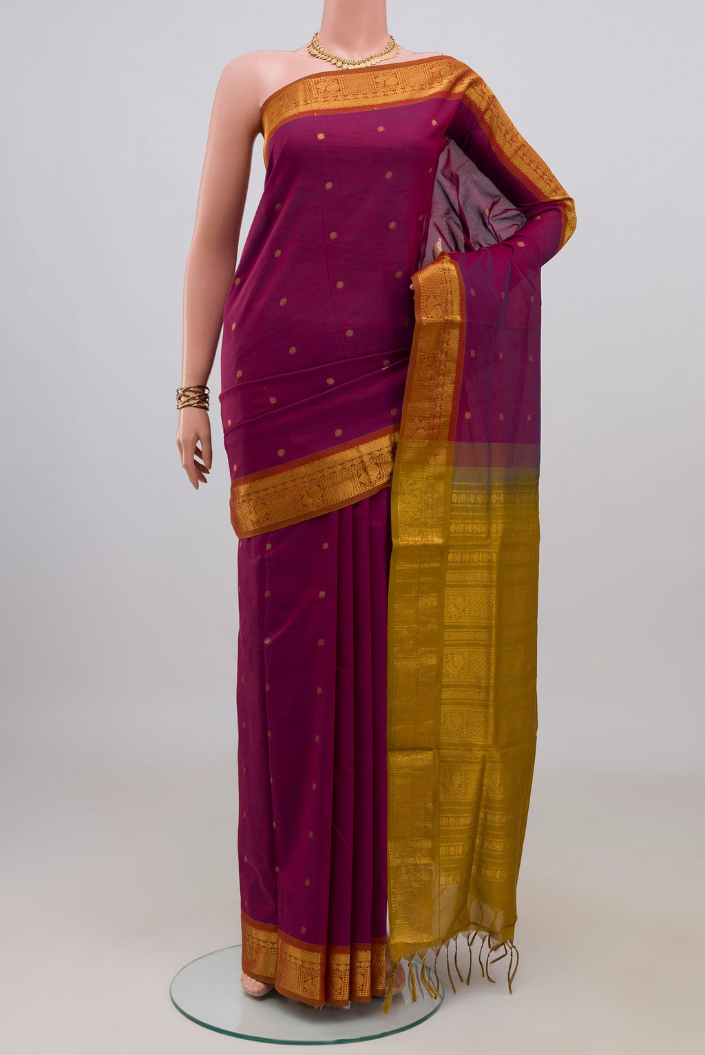Purple Blended Poly Cotton Saree with Zari Butta on the body and Zari Border.  displayed on a mannequin