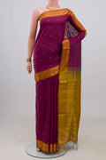 Purple Blended Poly Cotton Saree with Zari Butta on the body and Zari Border.  displayed on a mannequin