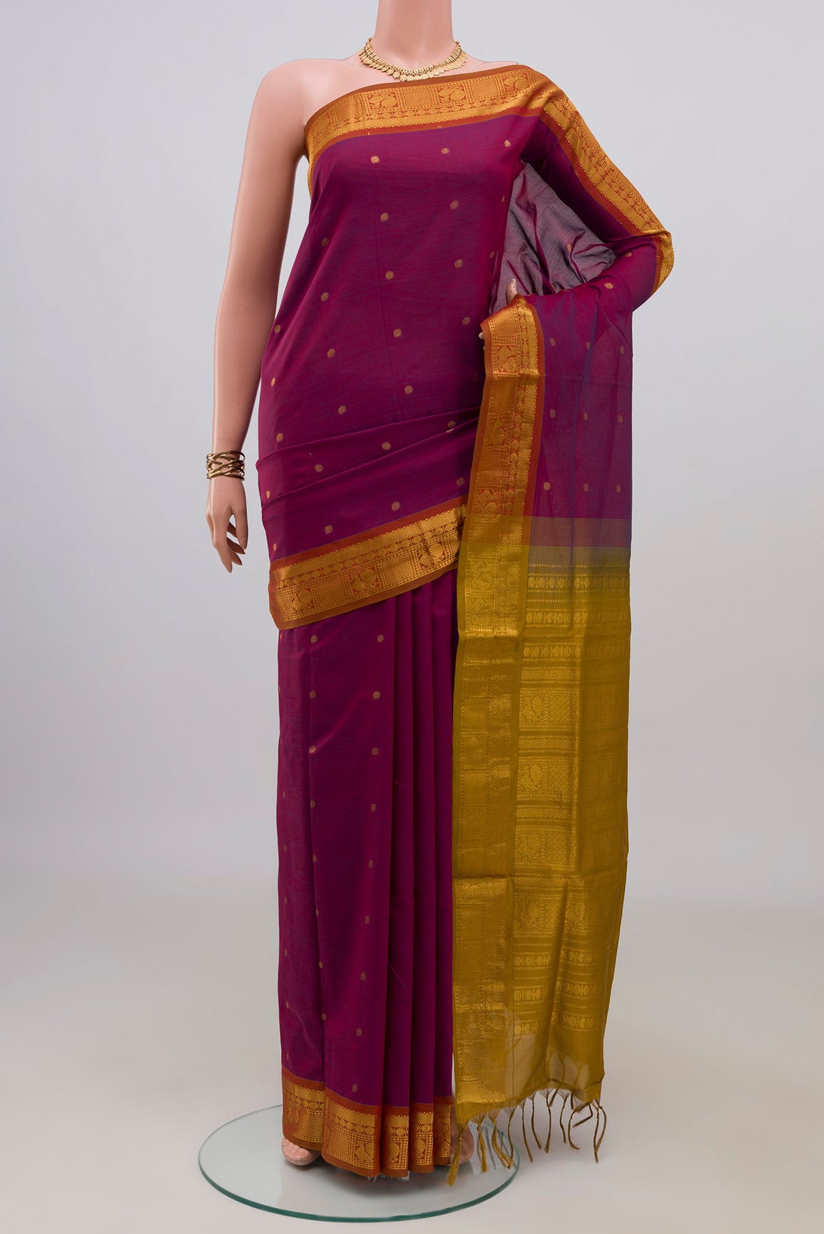 Purple Blended Poly Cotton Saree with Zari Butta on the body and Zari Border.  displayed on a mannequin
