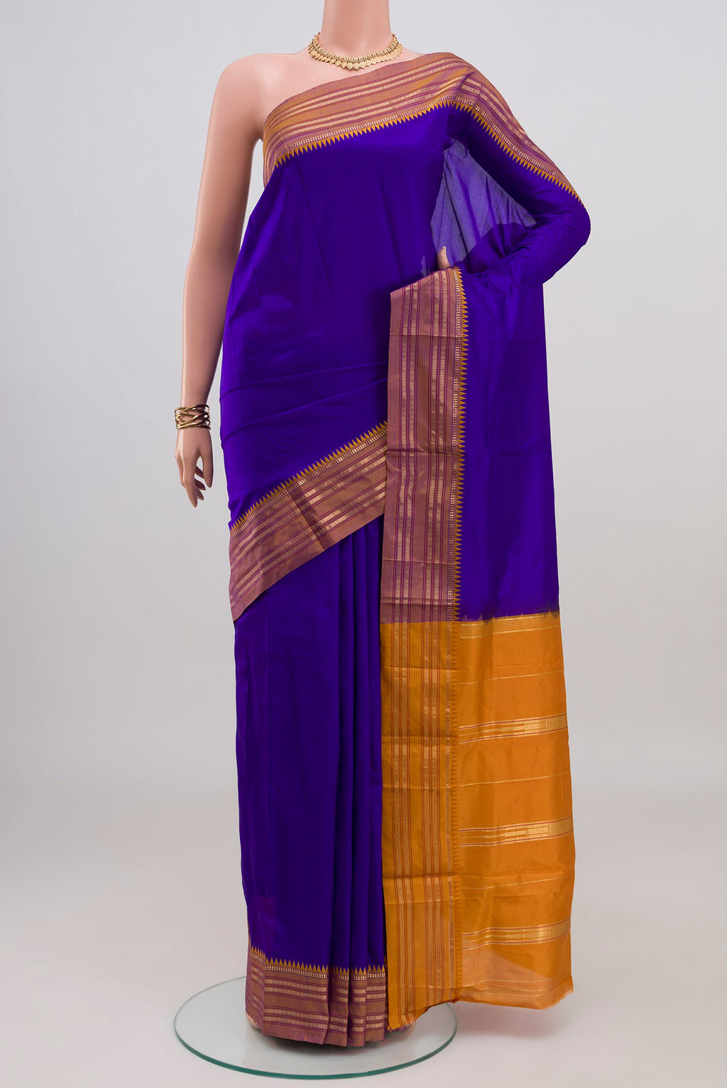 Blue Narayanpet Silk Saree with Plain Body and Zari Border.  displayed on a mannequin