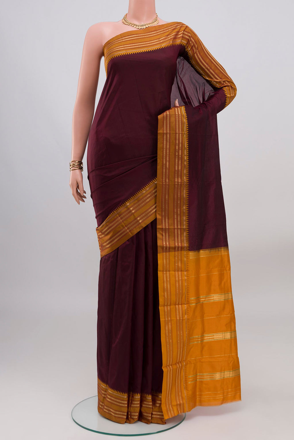 Coffee Brown Narayanpet Silk Saree with Plain Body and Zari Border.  displayed on a mannequin