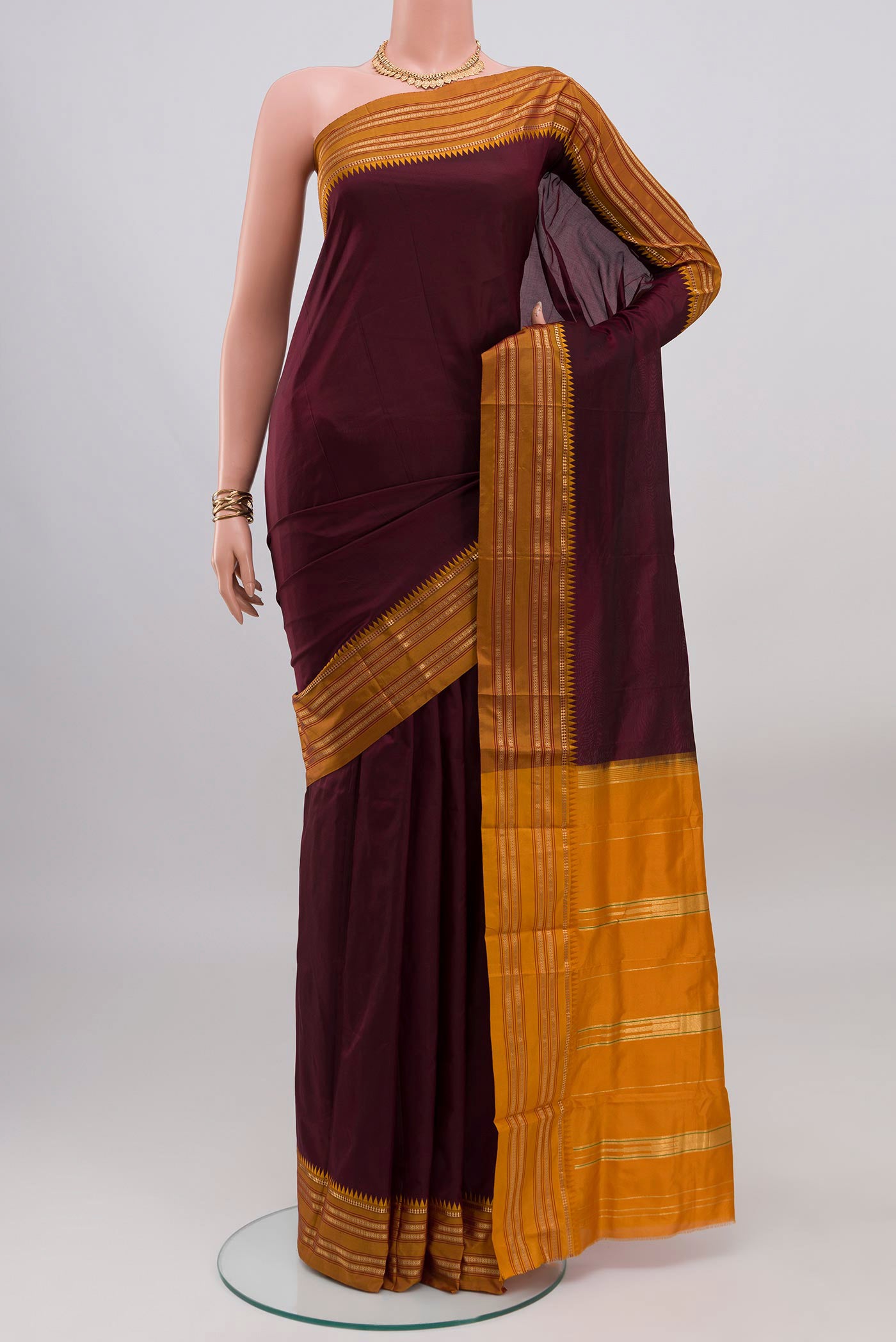 Coffee Brown Narayanpet Silk Saree with Plain Body and Zari Border.  displayed on a mannequin