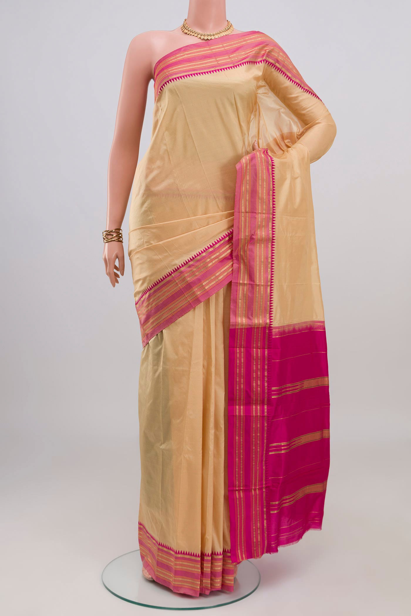 Cream Narayanpet Silk Saree with Plain Body and Zari Border.  displayed on a mannequin