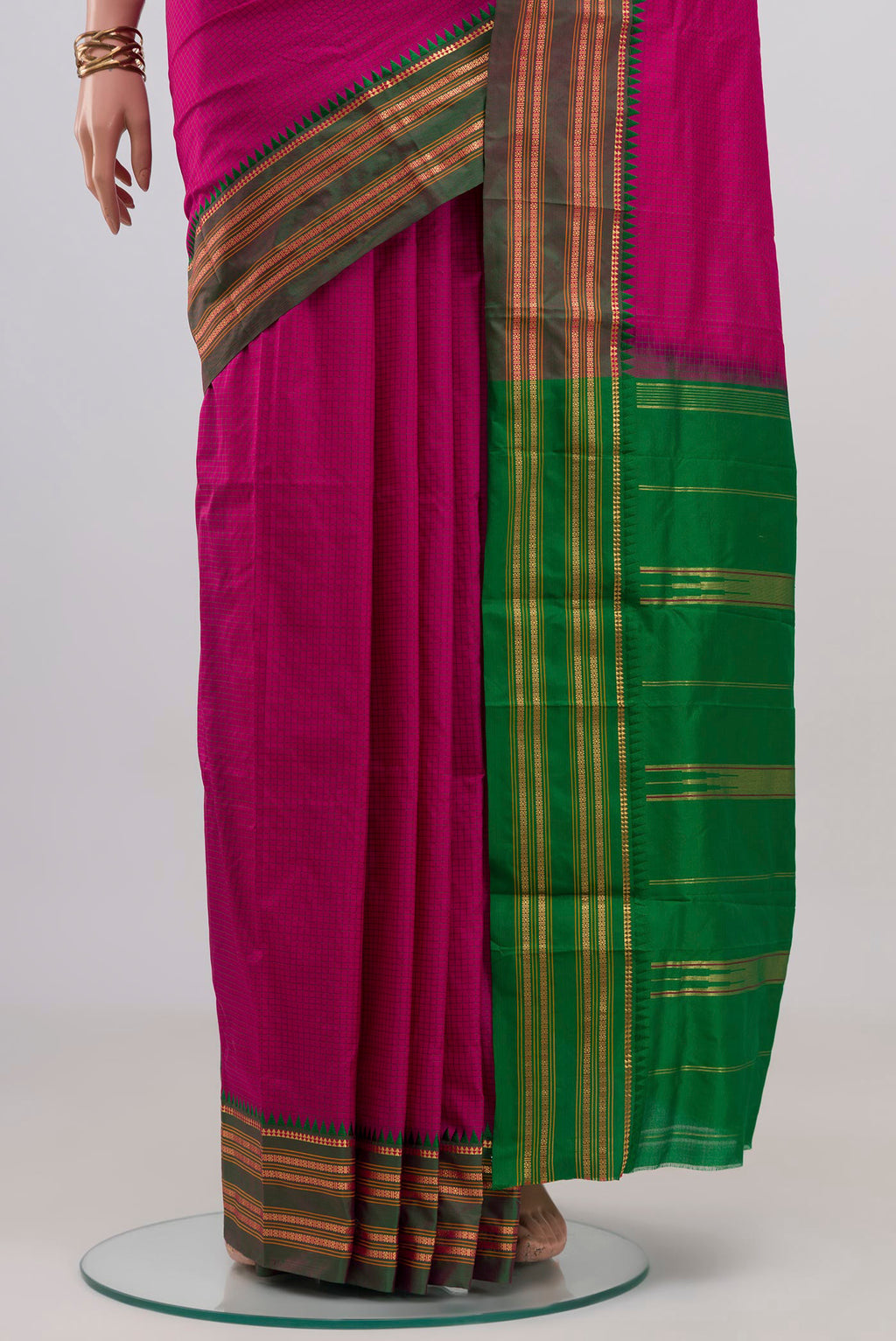 Pleats and pallu of Rani Pink Narayanpet Silk Saree with Checked design on the body and Zari Border. 