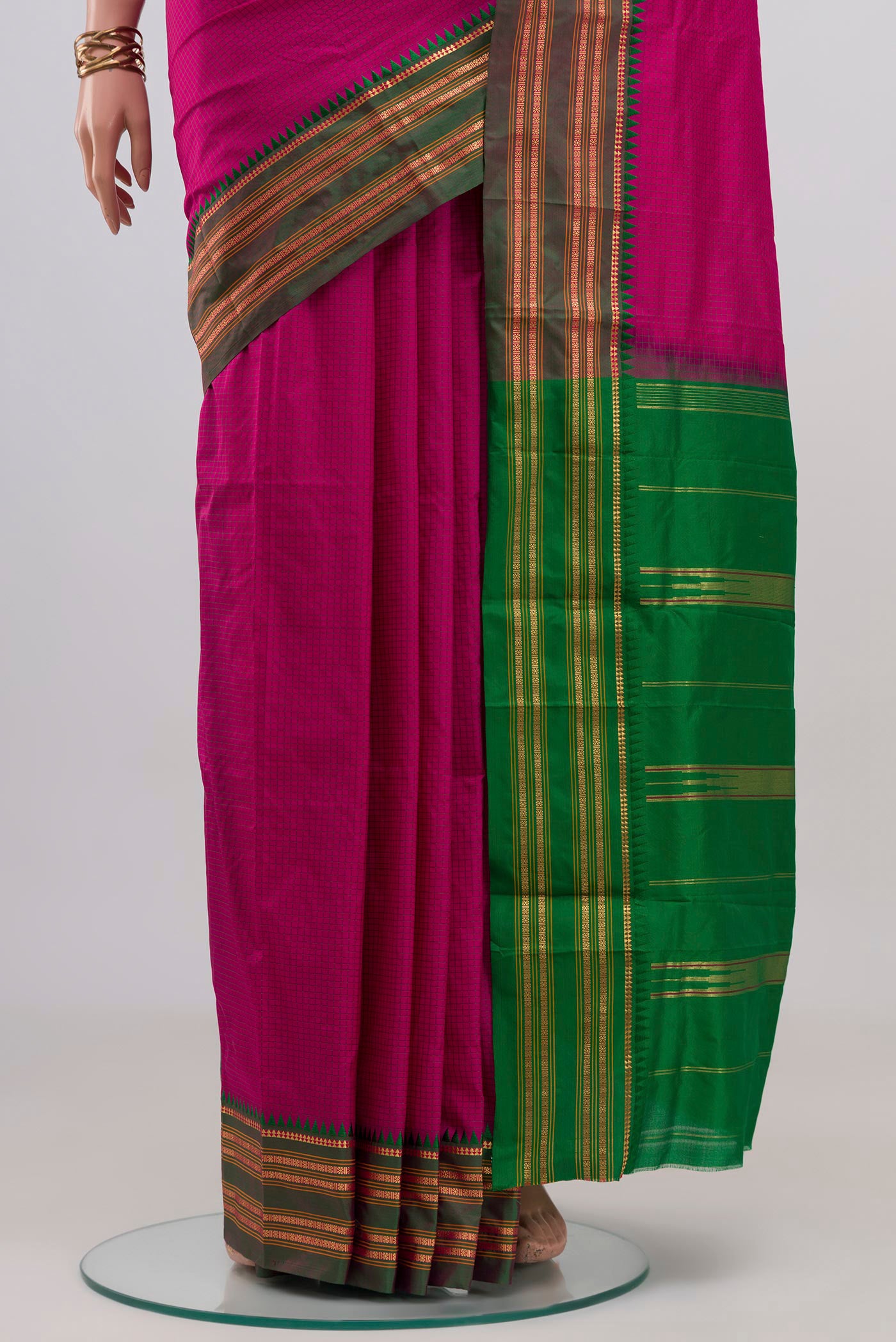 Pleats and pallu of Rani Pink Narayanpet Silk Saree with Checked design on the body and Zari Border. 