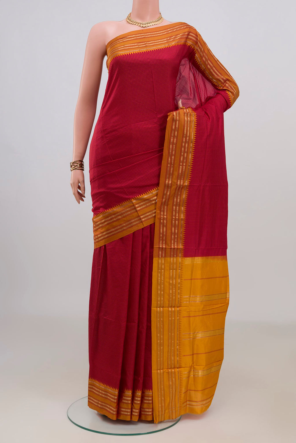 Pure Silk Maroon Narayanpet Saree with Checked design on the body and Zari Border.  displayed on a mannequin
