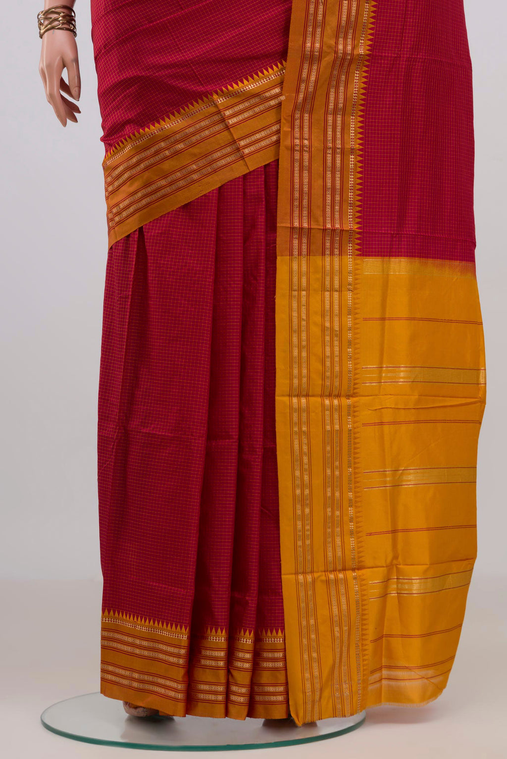 Pleats and pallu of Pure Silk Maroon Narayanpet Saree with Checked design on the body and Zari Border. 