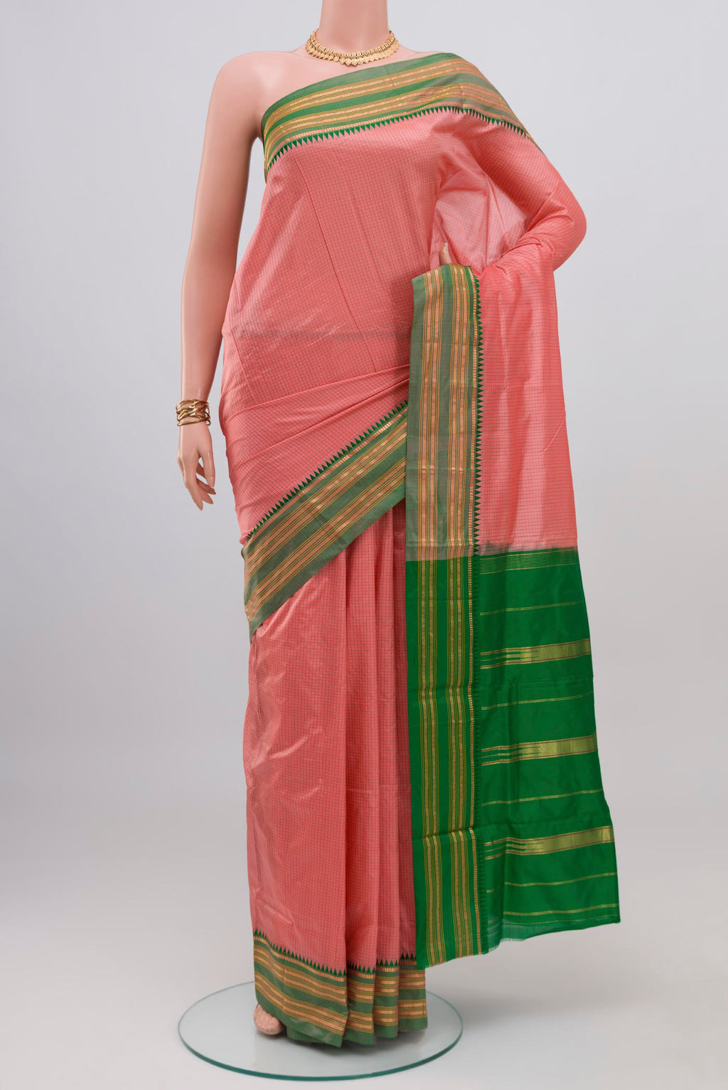 Coral Narayanpet Silk Saree with Checked design on the body and Zari Border.  displayed on a mannequin