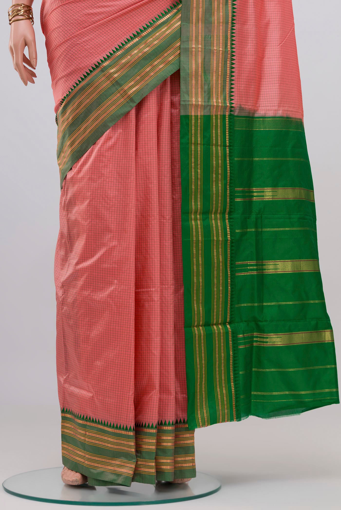 Pleats and pallu of Coral Narayanpet Silk Saree with Checked design on the body and Zari Border. 
