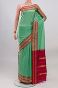 Sea Green Narayanpet Silk Saree with Checked design on the body and Zari Border.  displayed on a mannequin
