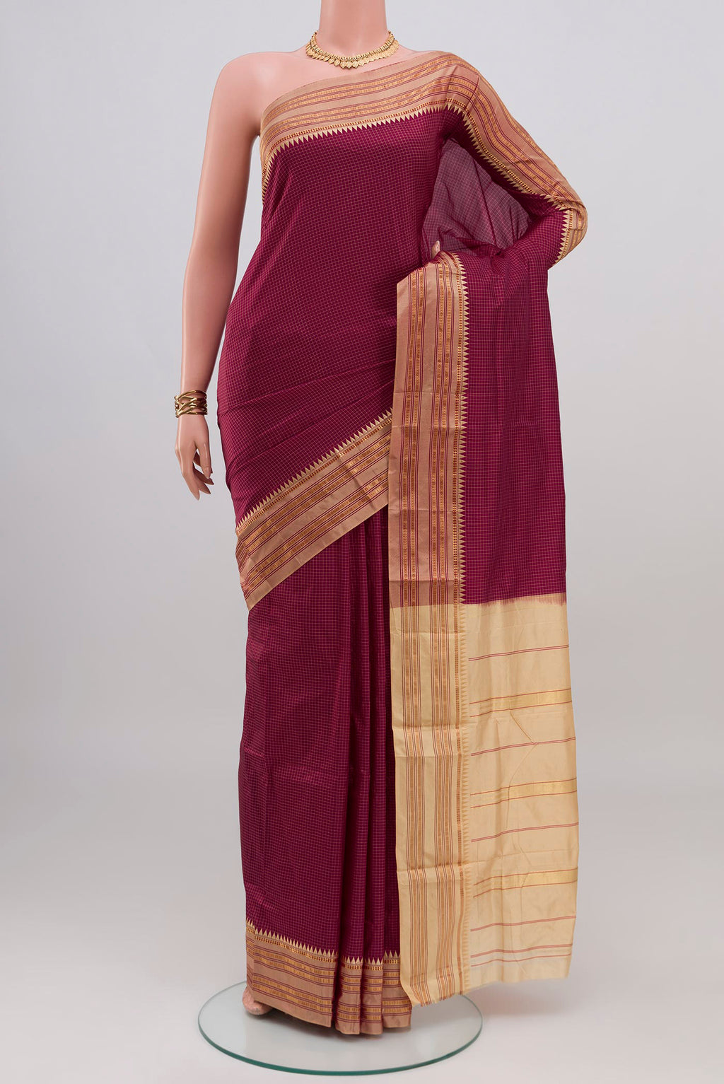 Magenta Narayanpet Silk Saree with Checked design on the body and Thin Zari Line.  displayed on a mannequin