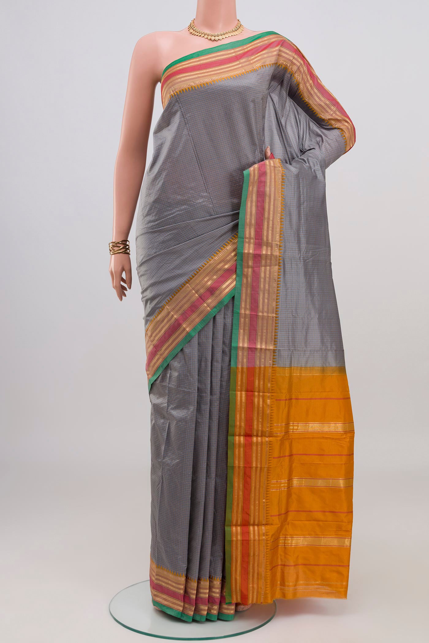 Grey Narayanpet Silk Saree with Checked design on the body and Zari Border.  displayed on a mannequin