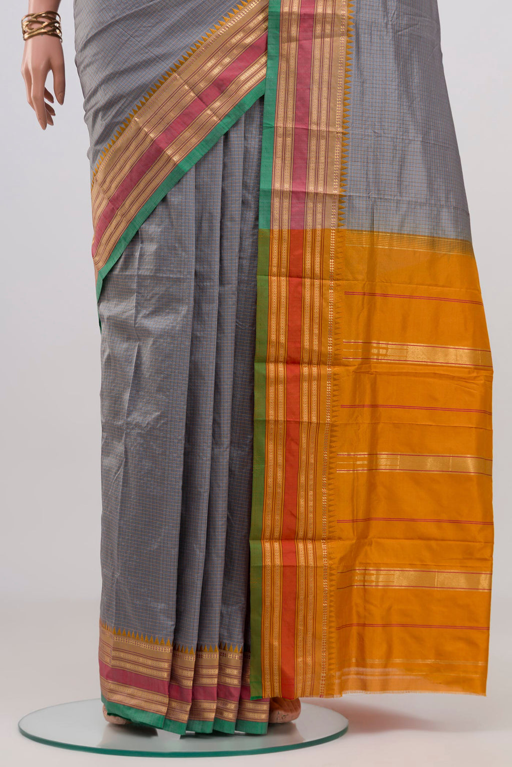 Pleats and pallu of Grey Narayanpet Silk Saree with Checked design on the body and Zari Border. 