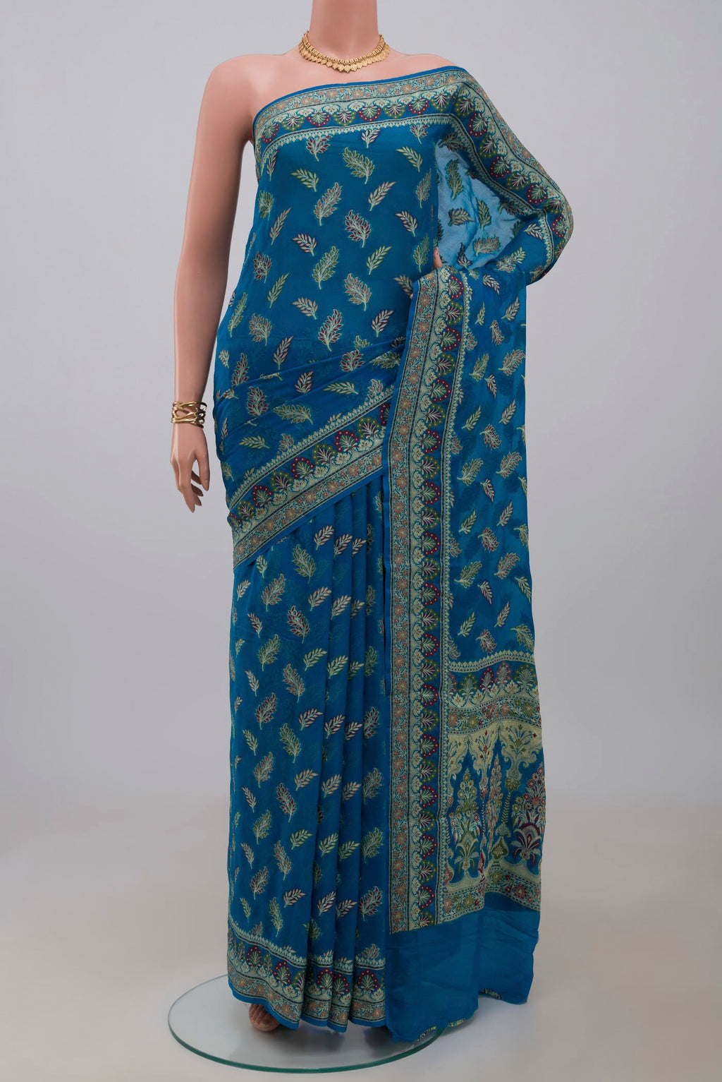 Blue Banarasi Georgette Saree with Thread Butta on the body and Thread Embroidery Border.  displayed on a mannequin